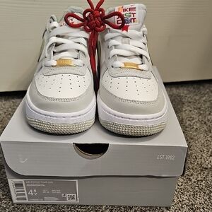 Nike Air Force 1 White and Gray Sneakers with Red Accents